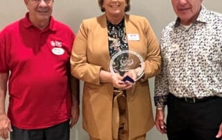 CEO Kelly McGillis (center) with Board Chair Doug Hall (right) and Board Vice Chair Jerry Cornell