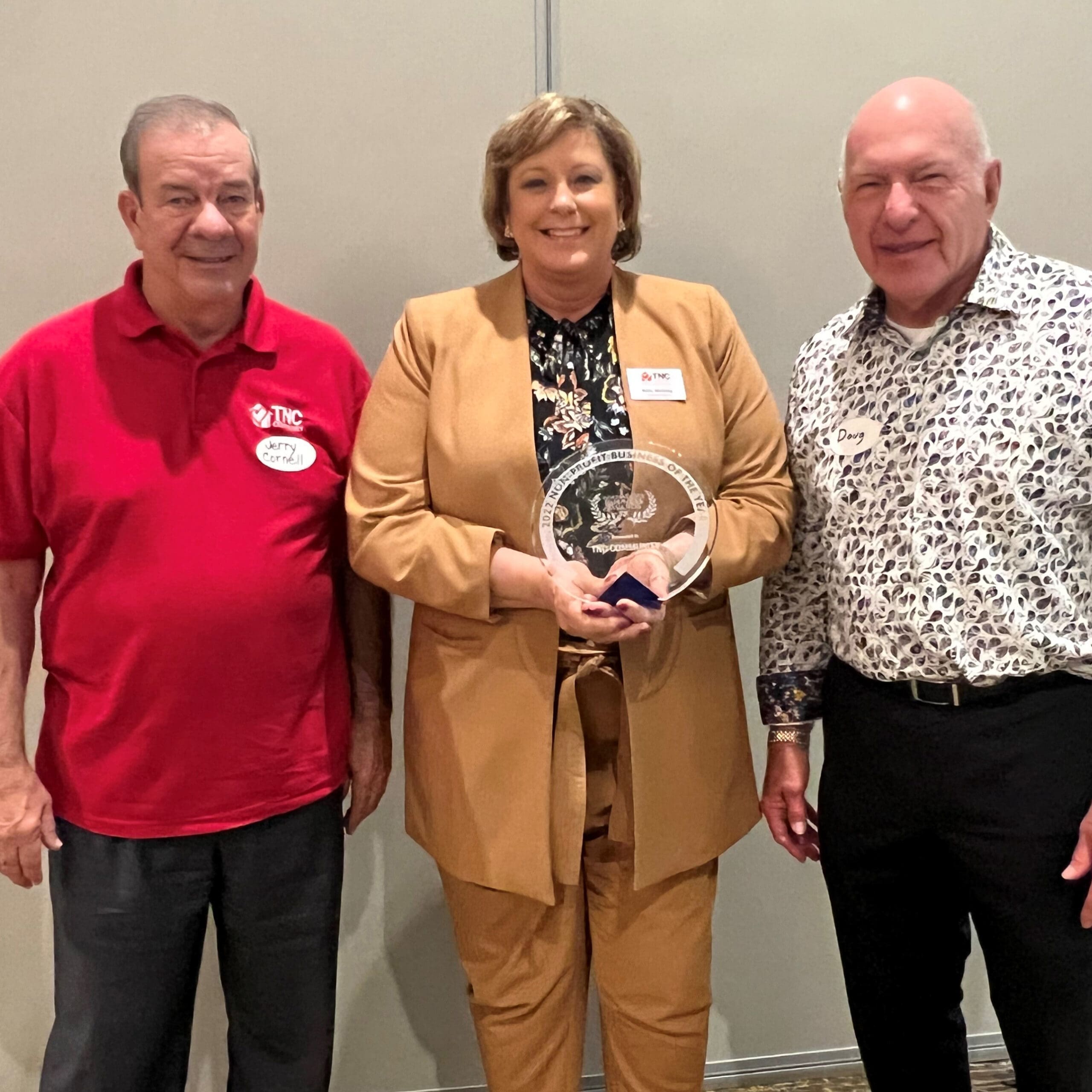 CEO Kelly McGillis (center) with Board Chair Doug Hall (right) and Board Vice Chair Jerry Cornell