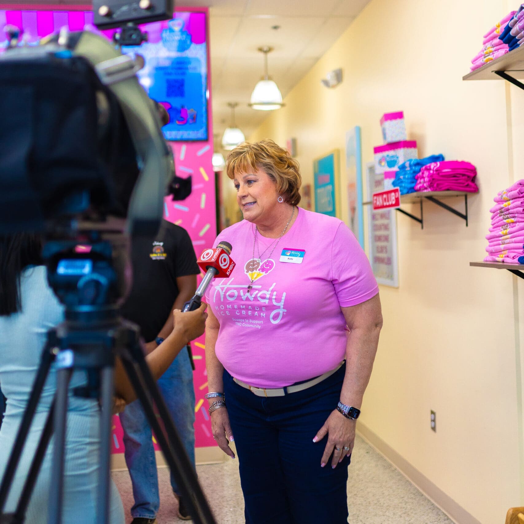 Kelly McGillis, TNC Community CEO being interviewed by press at Howdy Homemade Ice Cream grand opening