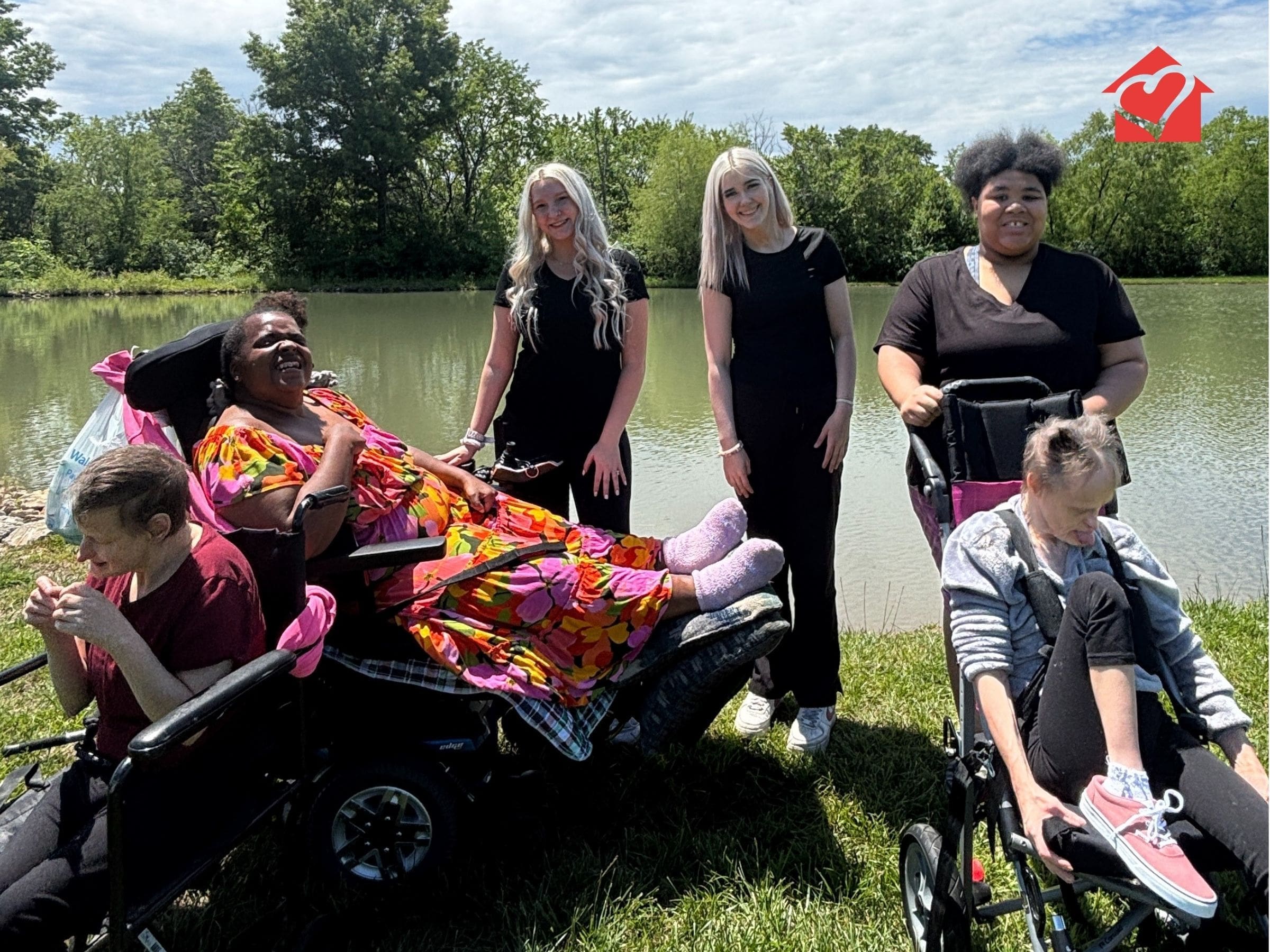 TNC Community residential living individuals and their staff enjoying the pond at Spring Fun Day