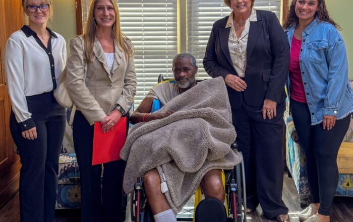 Senator Patty Lewis visiting TNC Community residential home for individuals with disabilities.