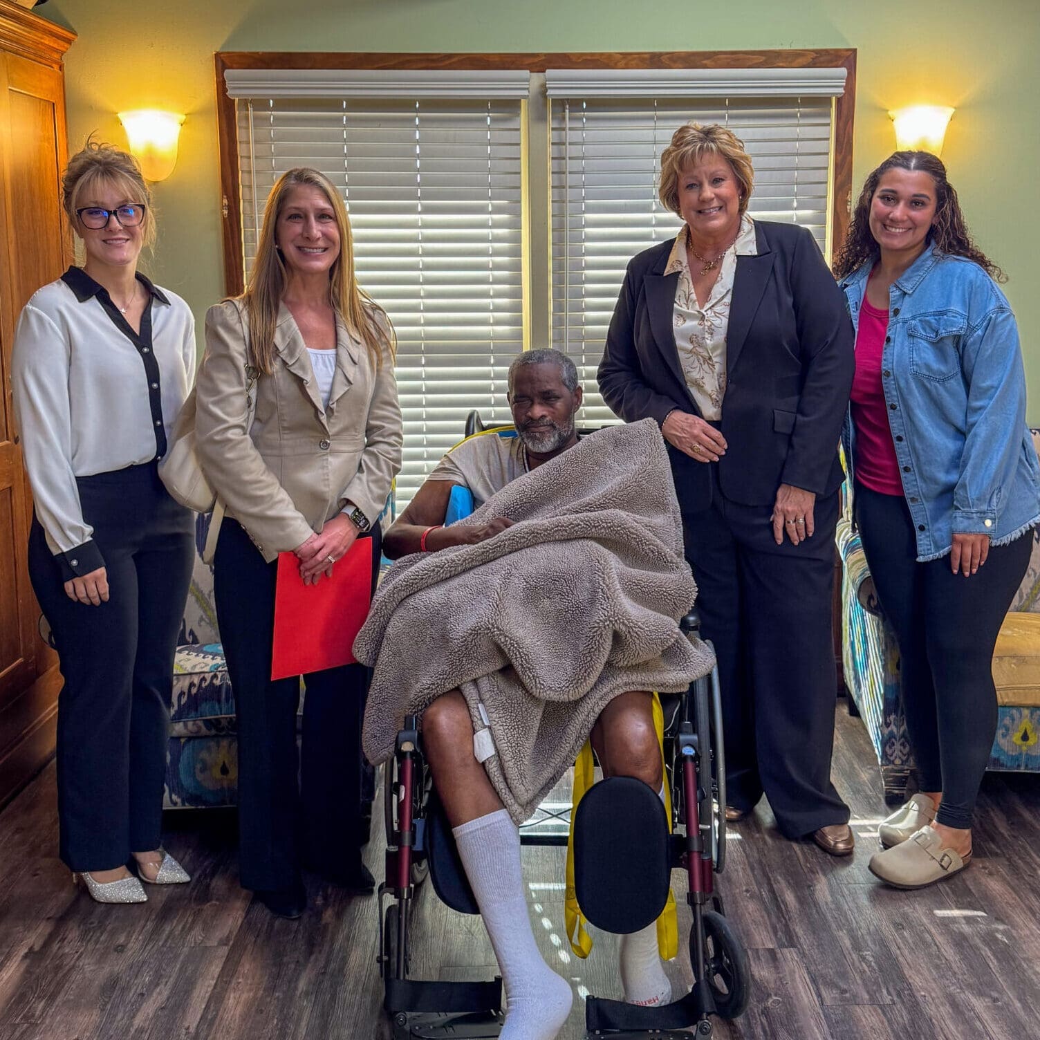 Senator Patty Lewis visiting TNC Community residential home for individuals with disabilities.